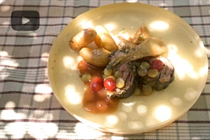 Lamb stuffed with graviera, wrapped in vine leaves and in a grape sauce